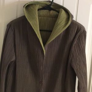 Hooded, fully reversible, knee length duster.